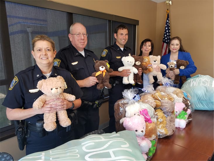 Paralegal Tammy Martinez and GLPA Donate Teddy Bears to Lexington Police Department